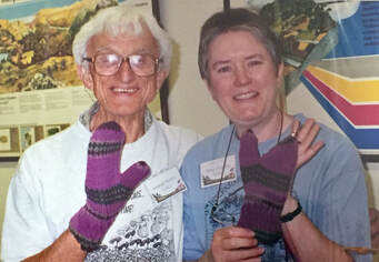 Picture of Sam Ristich and Susan Hopkins with mushroom dyed mittens